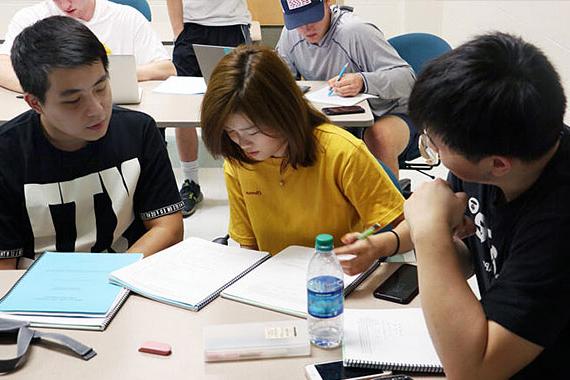 Three students working in study group